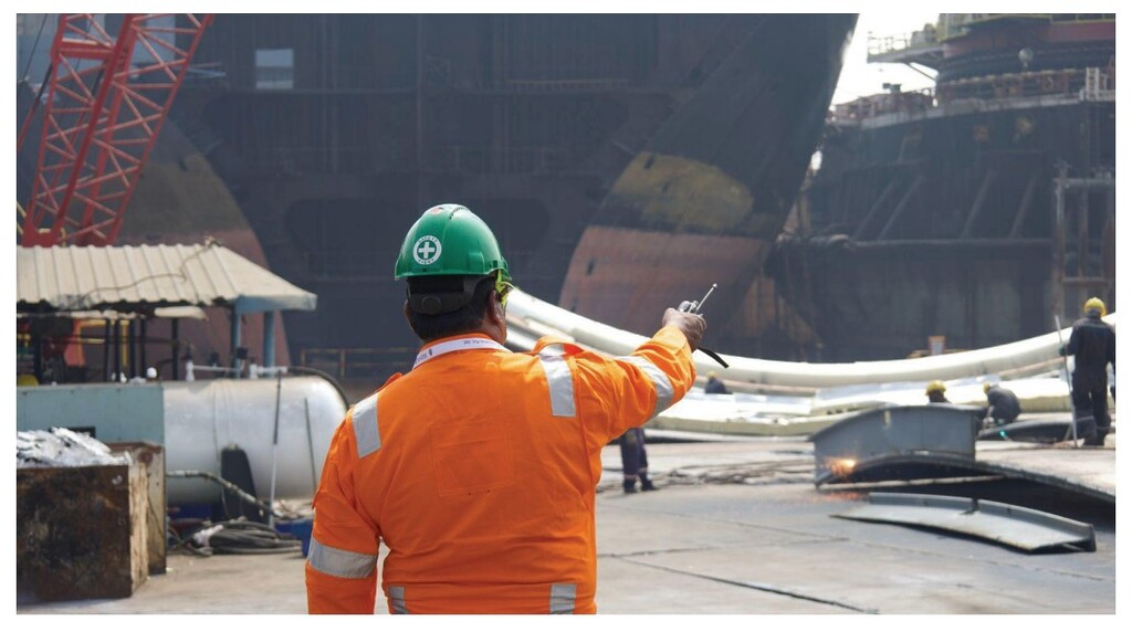 Ship recycling supervisor overseeing cutting operations at an Alang facility