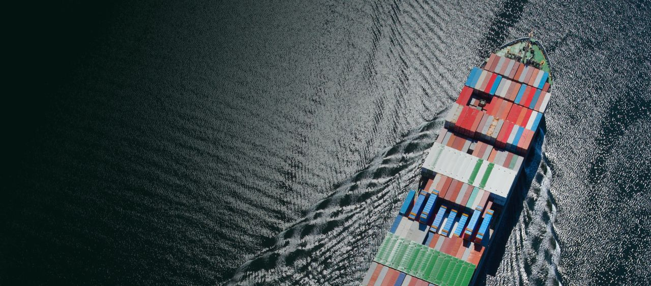 Drewry Container Shipping Market Outlook Webinar 2026 | Global Maritime Hub | Global Maritime Hub Aerial view of a container ship at sea, illustrating Drewry's container shipping market outlook for 2027