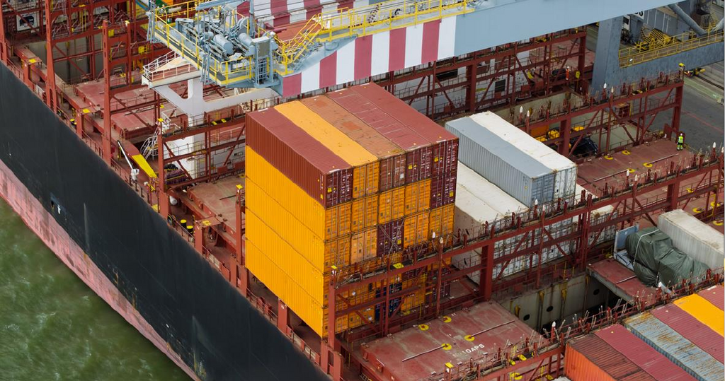 UK container port growth: containers stacked aboard a cargo ship